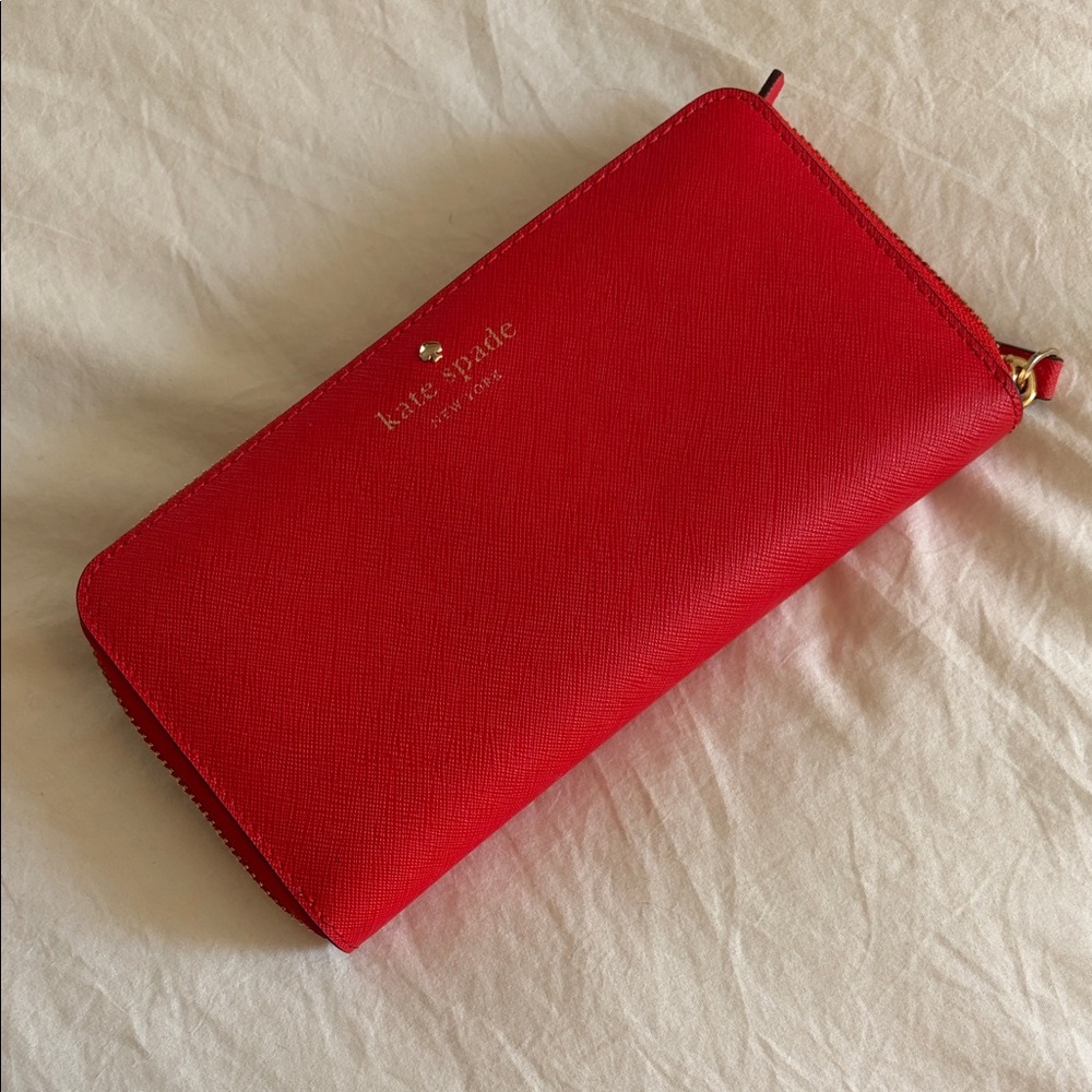 kate spade red saffiano zip wallet with gold logo